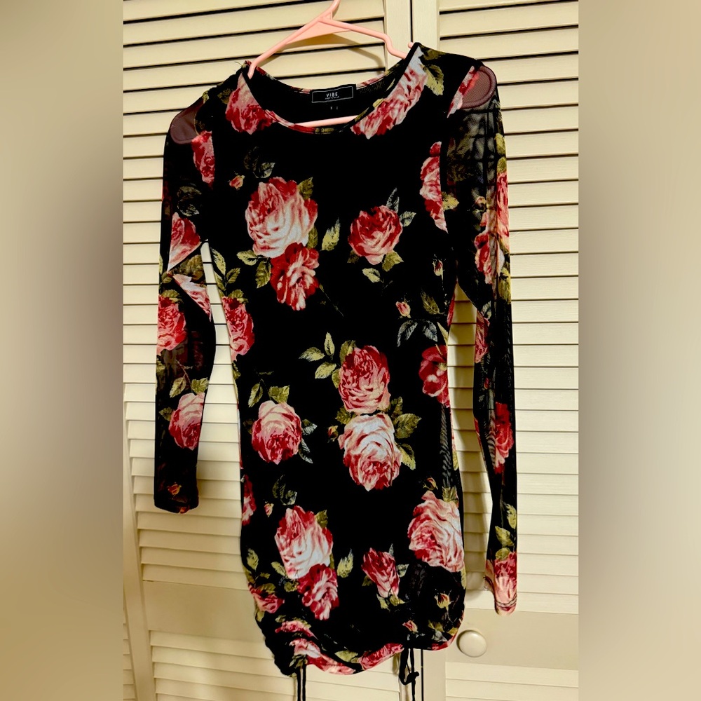 Short black dress with an inner piece and a soft outer piece.